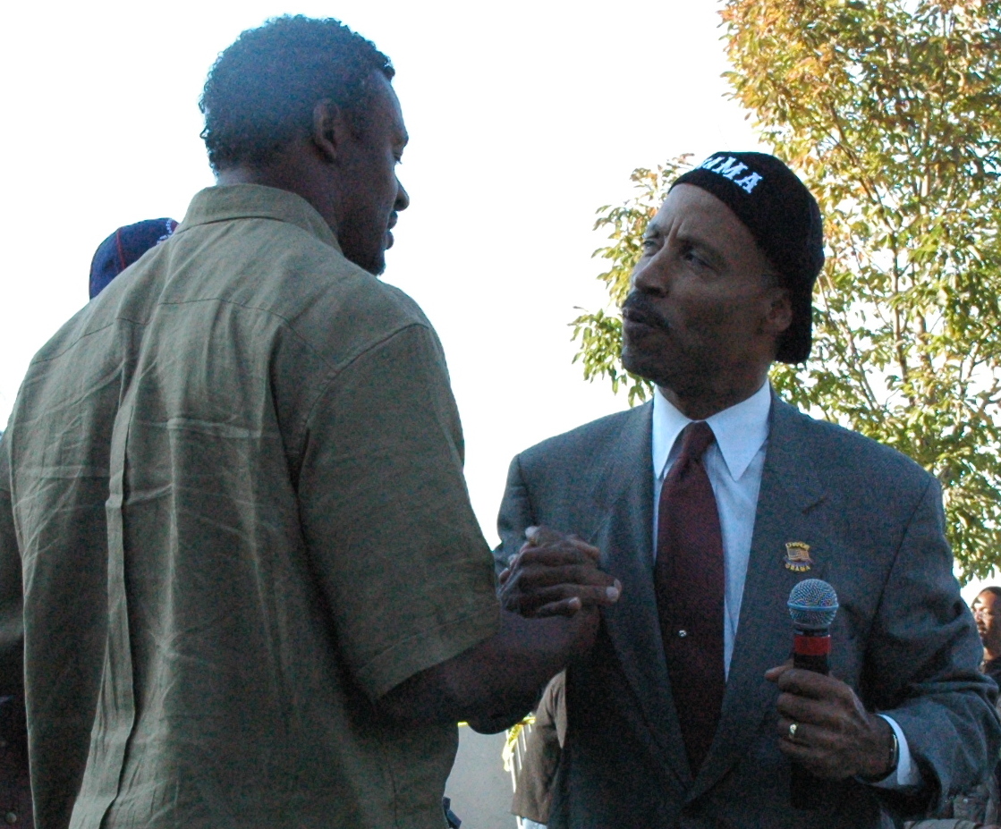 Cuyahoga County Commissioner Peter Lawson Jones Greeting Cleveland Browns Pro-Bowl Linebacker Willie McGinest Cuyahoga County Commissioner Peter Lawson Jones Greeting Cleveland Browns Pro-Bowl Linebacker Willie McGinest
