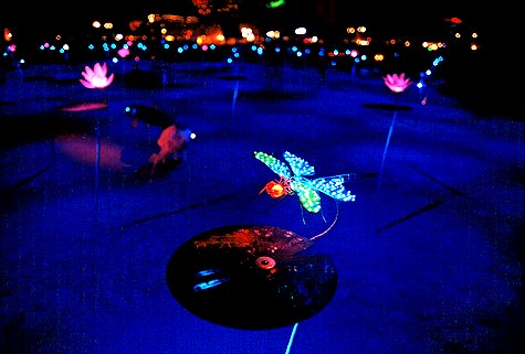 LED lighted dragonfly above metal lillypad