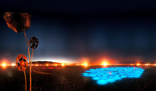 Patch of blue light in the desert at night